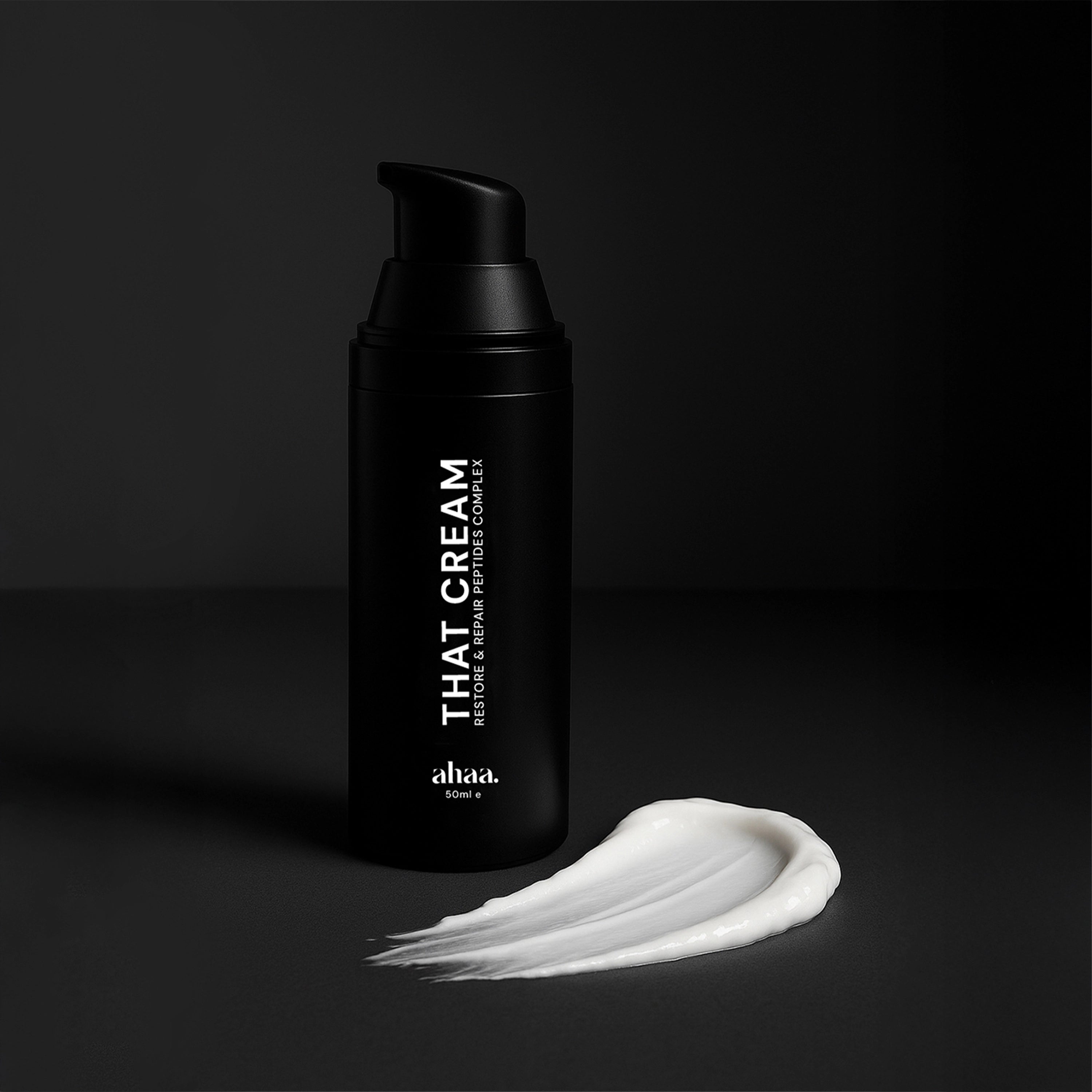Airless bottler of THAT CREAM by ahaa with a swatch of white peptides cream texture on a dark background