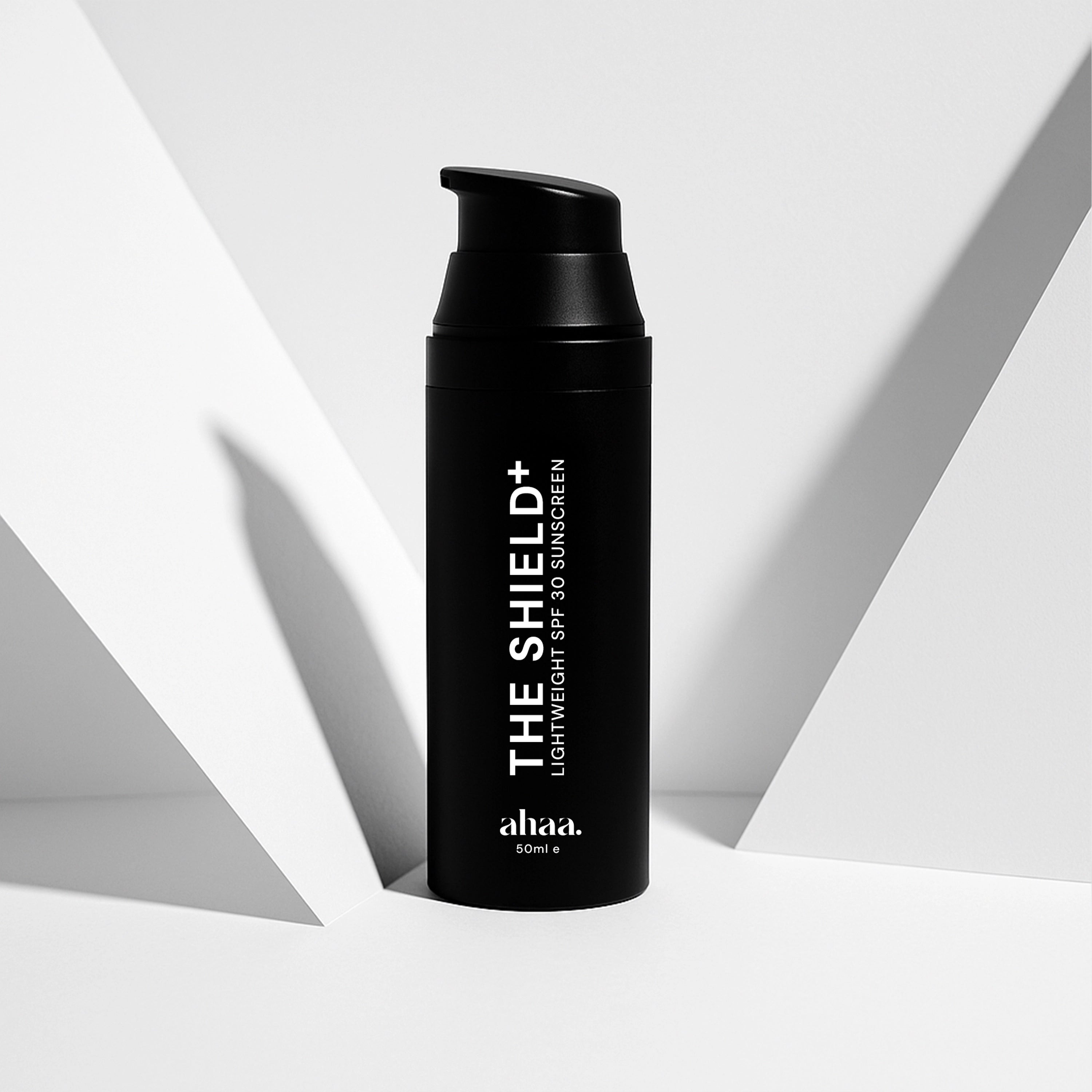 Ahaa sunscreen airless pump The Shield+ by ahaa on a white background